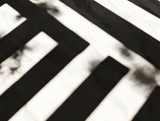 Poster - minimalist abstract composition featuring bold black and white geometric shadows cast on a textured 