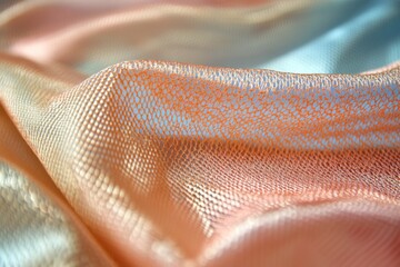 Leinwandbilder - Soft textured fabric draping elegantly in pastel shades of orange and blue under natural light