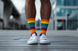© Di Studio - socks in lgbt rainbow flag colors on male legs on the street