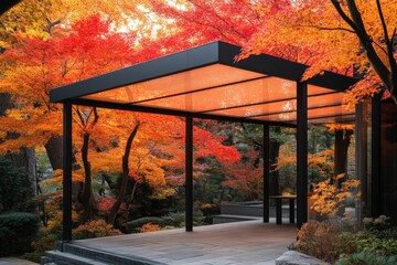 Poster - Modern pavilion surrounded by vibrant autumn foliage in a tranquil garden setting