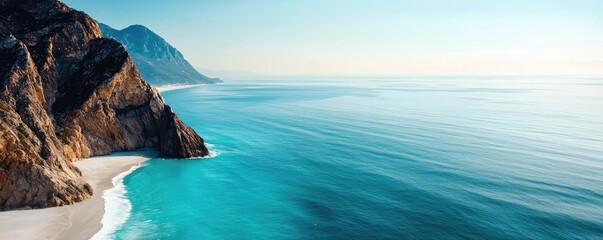 Poster - Seaside cliffs landscapes idea. Breathtaking view of a serene ocean meeting a tranquil shoreline under a clear sky.