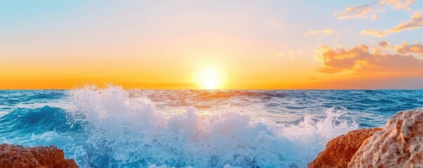 Poster - Sunset over ocean landscapes idea. A breathtaking sunset over the ocean with waves crashing against the rocky shore.