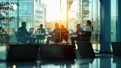 Poster - A diverse group of professionals is engaged in a collaborative meeting, discussing strategies, sharing ideas, and planning in a bright office space to enhance creativity and productivity