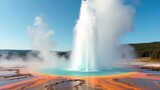 Majestic Yellowstone Geyser Eruption Vibrant Geothermal Pool and Steam Plume Landscape