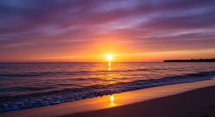 Poster - The sun is setting over the ocean, casting a warm glow on the water