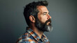 © otter2 - A close-up portrait of a bearded man's thoughtful expression, side profile, wearing a rugged plaid shirt