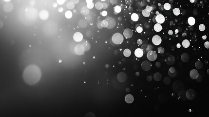 Fototapete - Abstract grayscale bokeh background with bright light spots and dark background.