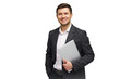© muse studio - Professional man in business attire holding a laptop and smiling against a white background