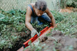 © velimir - measuring the slope level of a sewer pipe in a yard