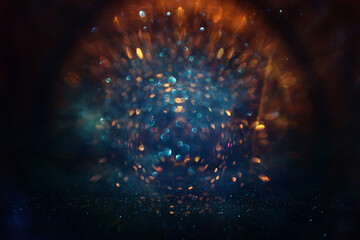 Wall Mural - abstract glitter blue and gold lights background. de-focused