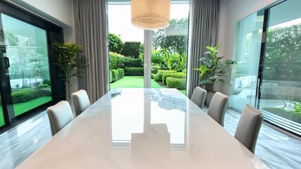 Poster - Modern Home Interior with White Marble Table and Garden View - 4K Video Background