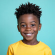 © serz72 - The joyful Afro American boy, around 8-10 years old, smiles brightly against a colorful background, ideal for modern advertising and promotional content