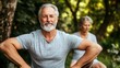 © Anindita - Senior couple smiling in garden, workout with trees
