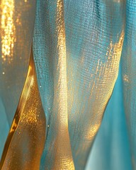 Poster - Shimmering gold and turquoise fabric cascade in soft folds creating a luxurious and elegant texture with a bright and airy feel for creative projects