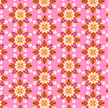 Symmetrical Floral Pattern with Vibrant Orange and Red Blooms on Pink Background