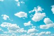 © Marharyta - Fluffy white clouds on vibrant blue sky. Artificial Intelligence