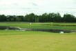 © New Africa - Blurred view of golf course on sunny day