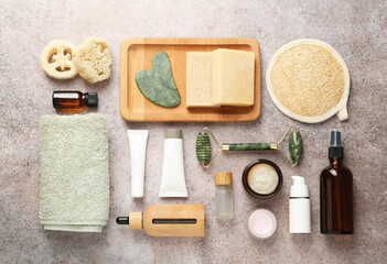 Wall Mural - different body care products and supplies on grey table, flat lay