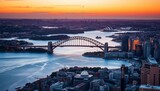 Golden hour light bathes Sydney Harbour Bridge, Lavender Bay, and city skyline from above,  light, aerial