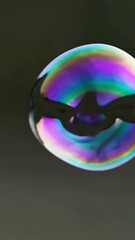Poster - Colorful liquid dynamics showcasing mesmerizing bubble expansion in slow motion