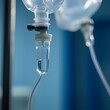 © Mujeeb - Close up medical intravenous IV drip in hospital background, Healthcare concept, Selective focus. Close up of medical drip or IV drip chamber in patient room,