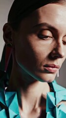 Poster - Artistic fashion portrait featuring bold geometric earrings on elegant model