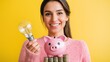 © Chanagun - A smiling woman holds a light bulb and a piggy bank, symbolizing smart financial decisions and savings concepts.