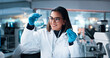 © peopleimages.com - Liquid, woman and scientist with beaker in laboratory for pharmaceutical experiment, research or innovation. Chemical, glass and female medicinal chemist with formula, reaction observation or cure.