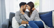 © BuyoutReese10/peopleimages.com - Forehead, love and bonding with couple on sofa of home for cuddle, support and care. Happy, commitment and trust with man and woman in living room of apartment peace, smile and relationship romance
