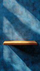 Poster - Wooden shelf casting shadows on textured blue wall, minimalist space. Interior design idea.