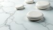 © RichardL - Polished spa stones create a visually appealing pattern on a bright white marble surface , still life, clean