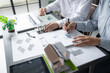 © Charlie's - Solar panels green energy Business man working green eco friendly office business creative idea Planing Bio economy for business eco friendly professional Engineer sustainable electricity.