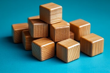 Poster - Various wooden blocks stacked playfully on a blue background showcasing their natural finish and texture