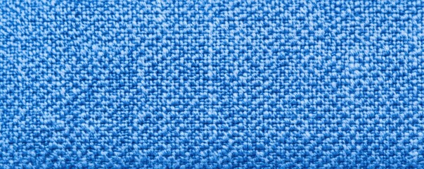 Poster - A close-up view of a textured blue fabric, showcasing intricate weaving and vibrant color, Denim Texture woven  seamless.