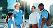© KayExam/peopleimages.com - Smile, professor and group students in city for medical study, nursing program and healthcare opportunity. People, teacher and funny joke of morning commute, learning internship and university course