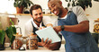 © AchillesReel25/peopleimages.com - Tablet, happy and team of baristas in cafe for checking stock list together for opening business. Digital technology, good news and waiters with coffee shop for menu development for online order.