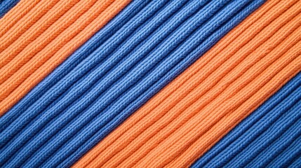Poster - A close-up view of textured fabric featuring alternating blue and orange stripes in a ribbed pattern, Denim Texture woven seamless.