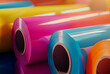© Nick Alias - Colorful plastic film rolls in bright light, glossy vinyl material for packaging, printing or industrial manufacturing use
