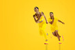 © Lustre Art Group  - Energetic collage. Two sprinters, man and woman, in yellow launching into race, perfectly synchronized with motion. Monochrome color. Concept of professional sport, teamwork, speed, competition.
