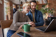 © ReeldealHD images - Couple planning their future finances together looking at a laptop