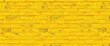 © tpadobestock - A textured background of a yellow brick wall, showing variations in color and mortar, yellow brick wall, grunge