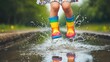 © DREAMERLYN STUDIO - Child jumping into a puddle, water splashing joyfully around bright rain boots