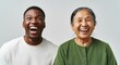 © Postmodern Studio - Joyful connection: african adult male and asian elderly female smiling together