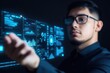 © Wanida - Young man interacting with futuristic data dashboard in dark setting