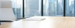 © Exnoi - Modern Office Workspace with City View and Empty Chair at Desk