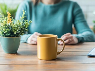 Aufkleber - Professional woman working at a table with a mug and a plant in a cozy and inviting workspace environment