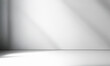 © Jani's Stocks - Minimal wall interior background with soft white and grey tones. Studio backdrop with natural window shadows, perfect for product presentation, branding, and text insertion. Ideal for wallpapers.