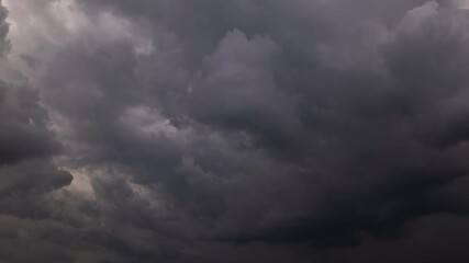 Wall Mural - time lapse, dark sky with stormy clouds. dramatic sky rain,dark clouds before a thunder-storm.