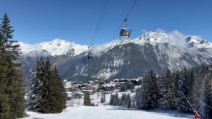 Fototapete - View of Courchevel ski resort slopes and town in the background by winter