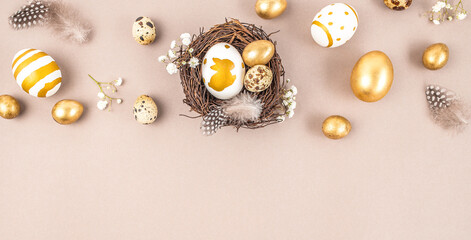 Wall Mural - decorations, easter eggs in a nest on a beige background. happy easter flat lay concept.